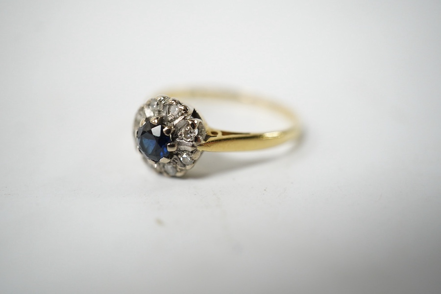 A small 18ct gold, sapphire and diamond set circular cluster ring, size J, gross weight 2.3 grams. Condition fair to good